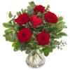 Kimppu jossa punaisia ruusuja ja sydänkoriste
